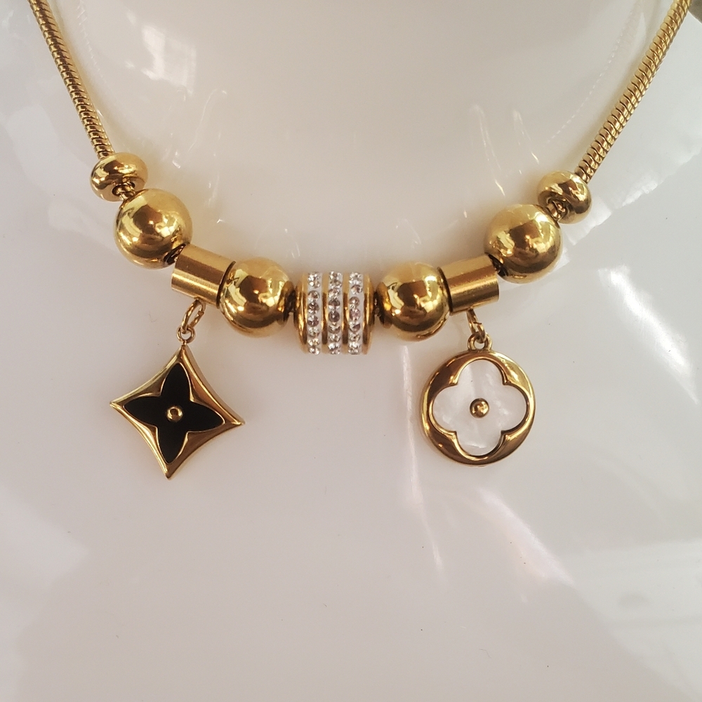 Elegant Gold and Black Charm Bracelet